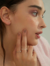 wearing Lena Pearl Beaded Ring and single pearl ring